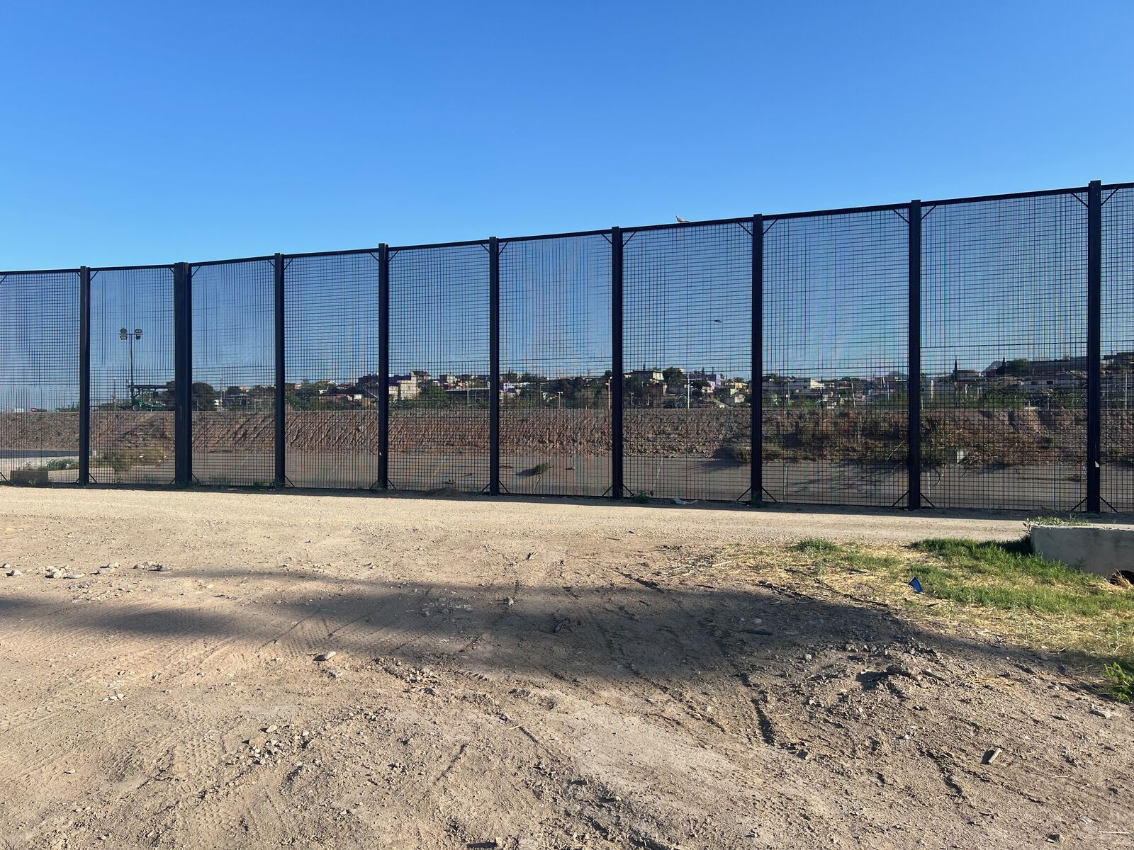 Border fence and dirt road