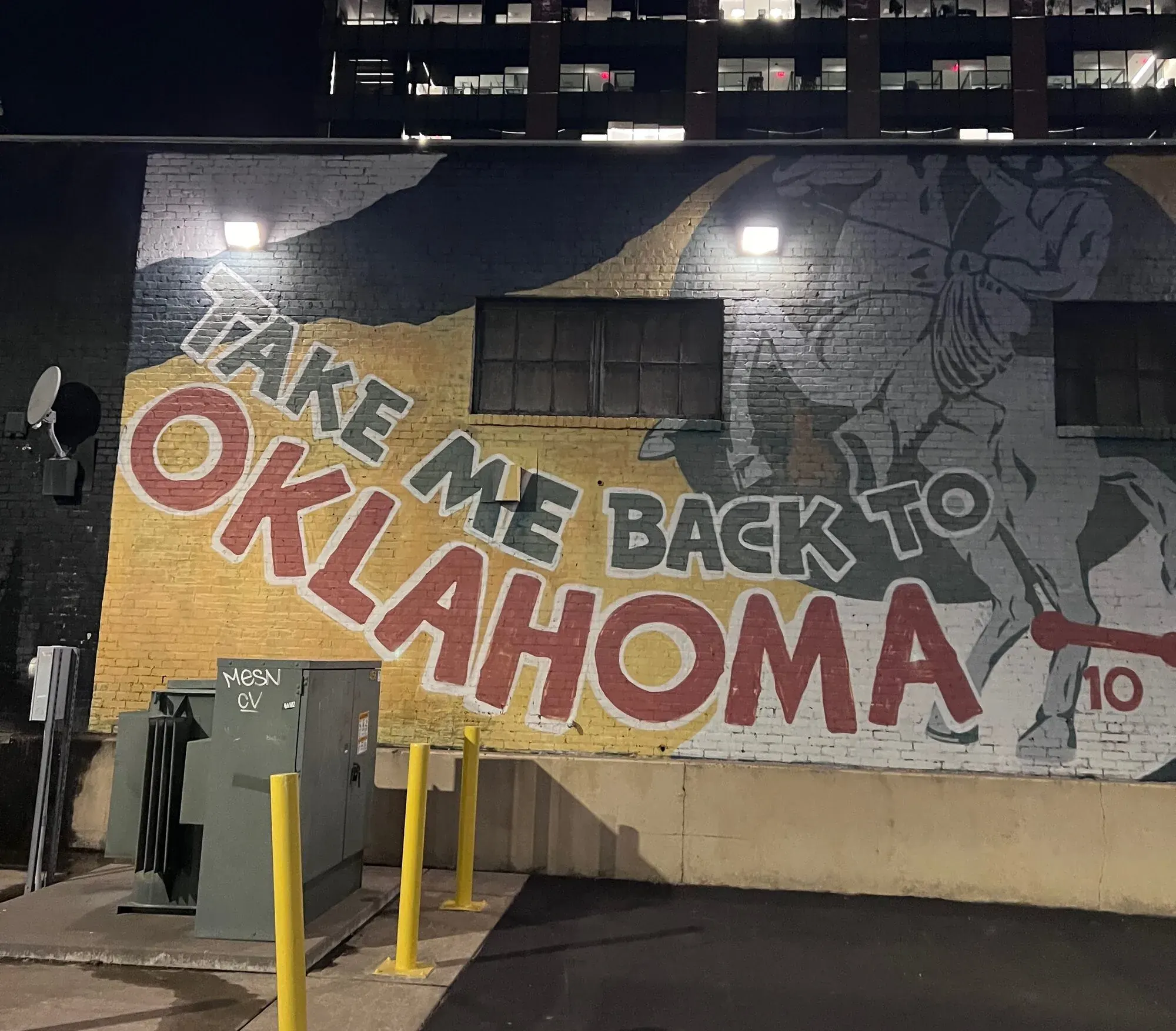Take Me Back to Oklahoma mural at night in Tulsa
