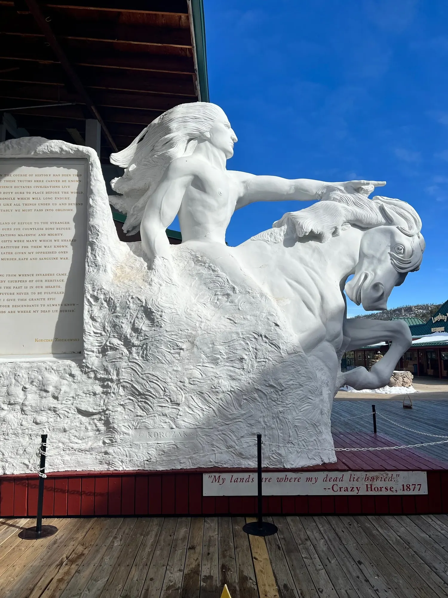 A white plaster model of the finished Crazy Horse Memorial, showing Crazy Horse on horseback with his arm extended, at the Crazy Horse Welcome Center