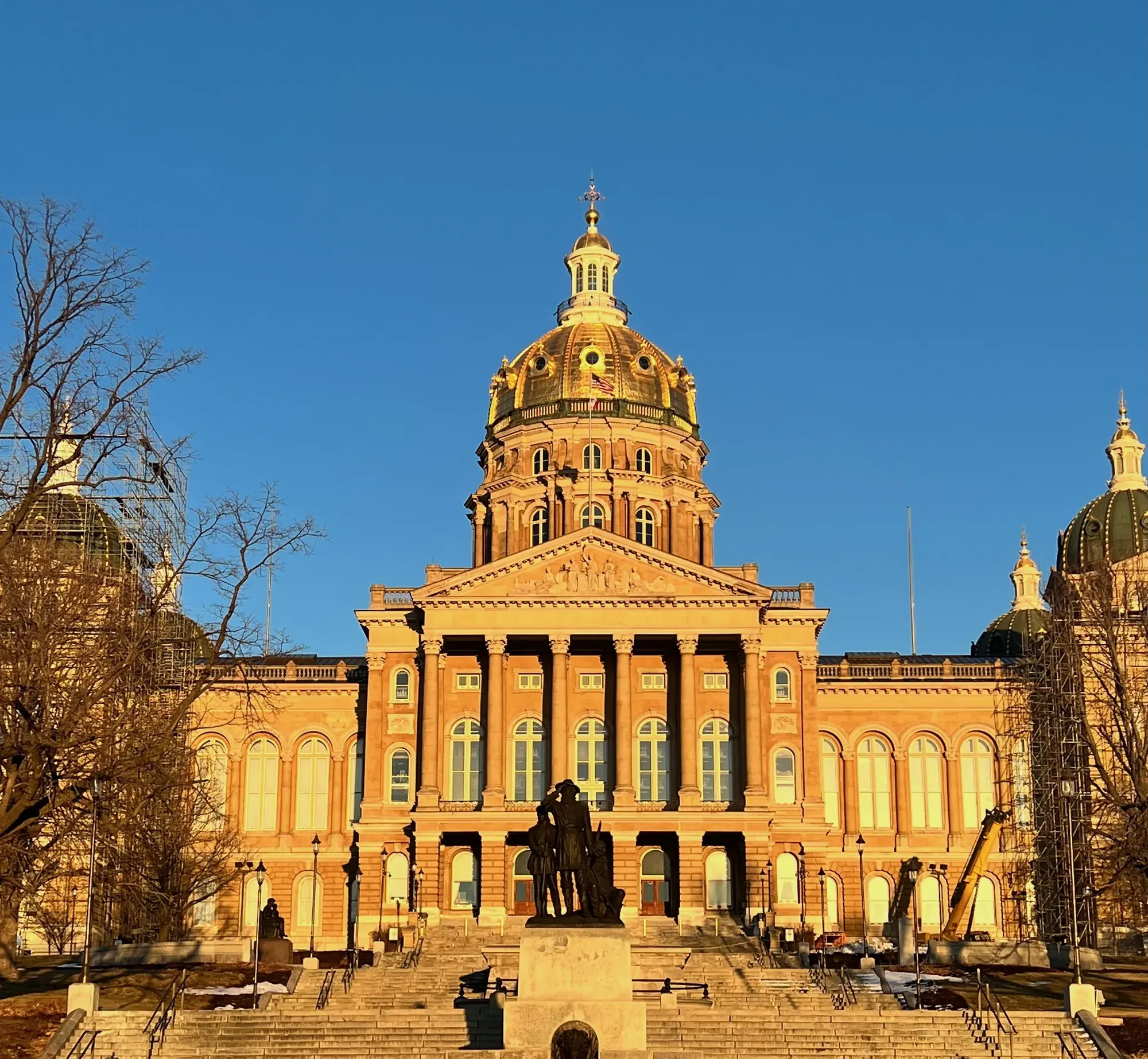 The Iowa State Capitol dome glowing gold in the setting sun, Des Moines