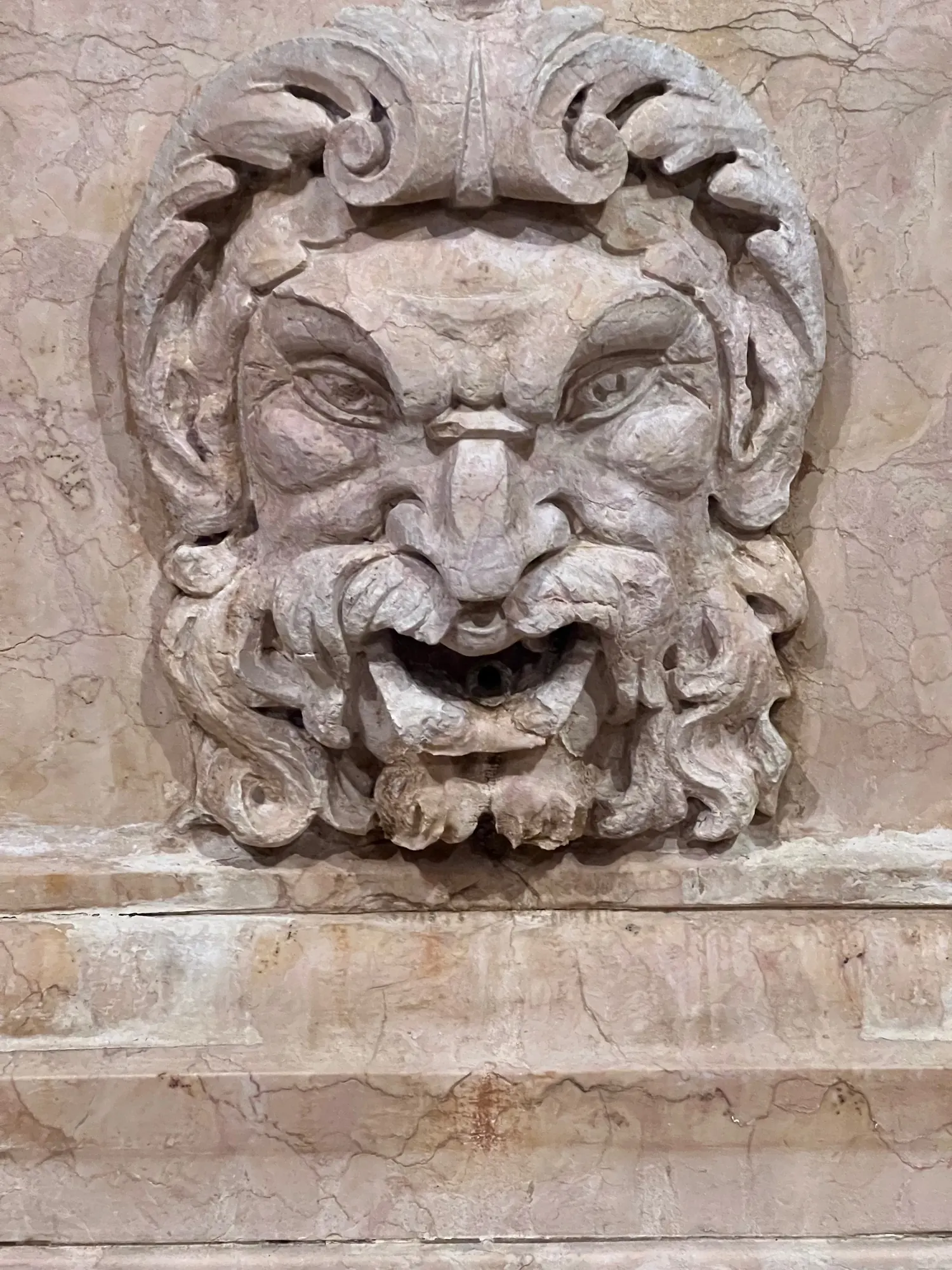Carved stone face at the Philbrook Museum