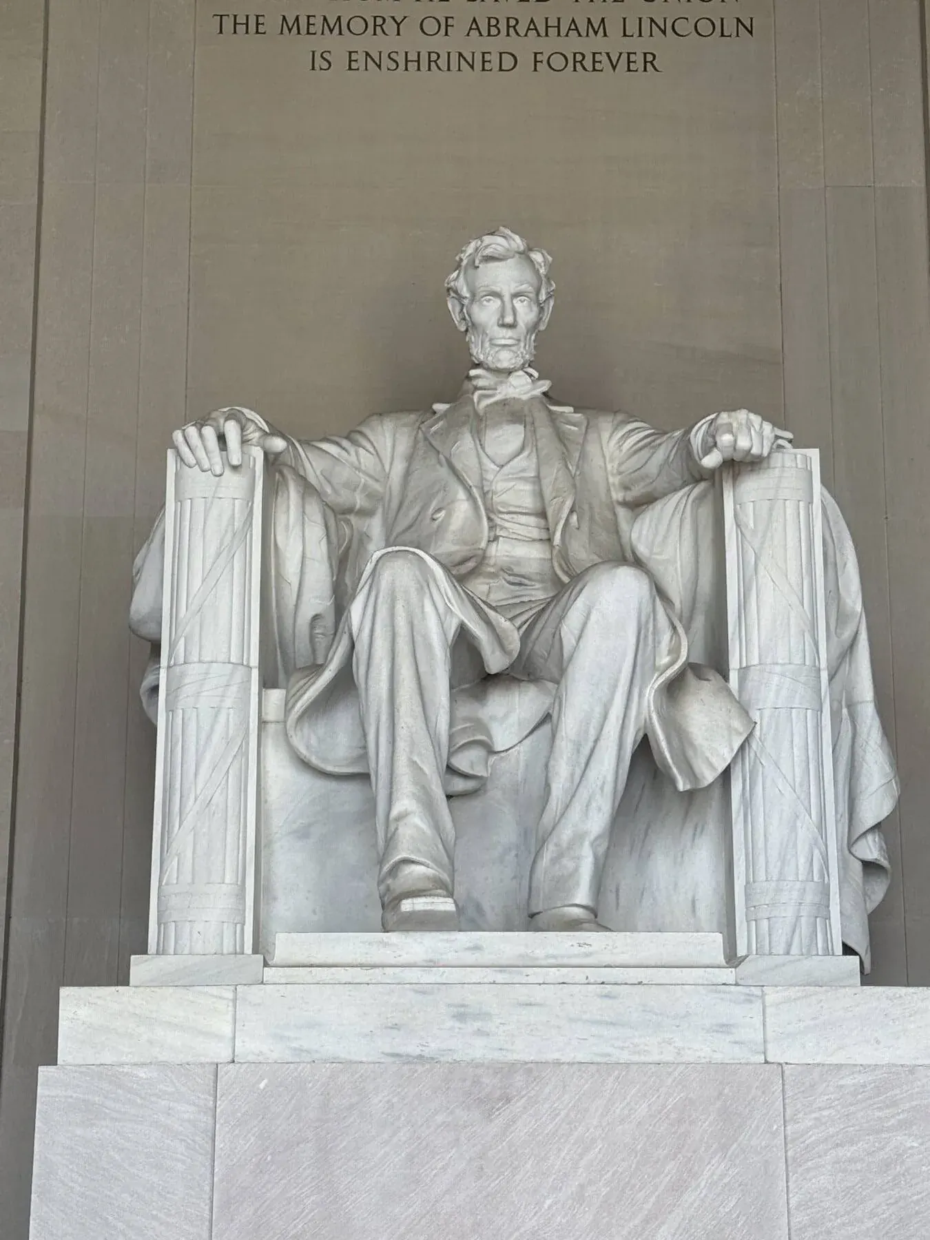 Abraham Lincoln seated inside the Lincoln Memorial