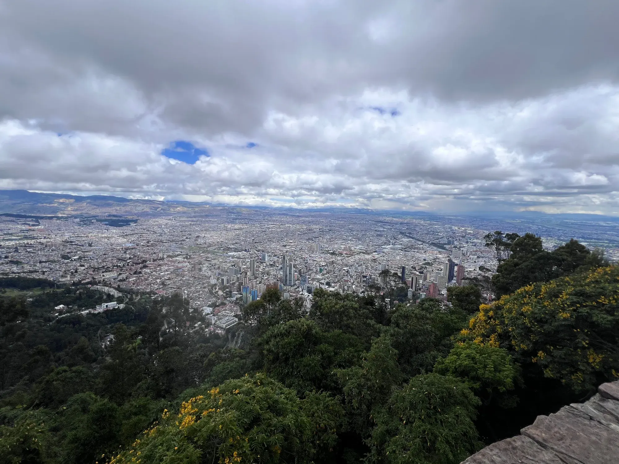 Aerial view of Bogota spreading out under a cloudy sky, seen from Monserrate